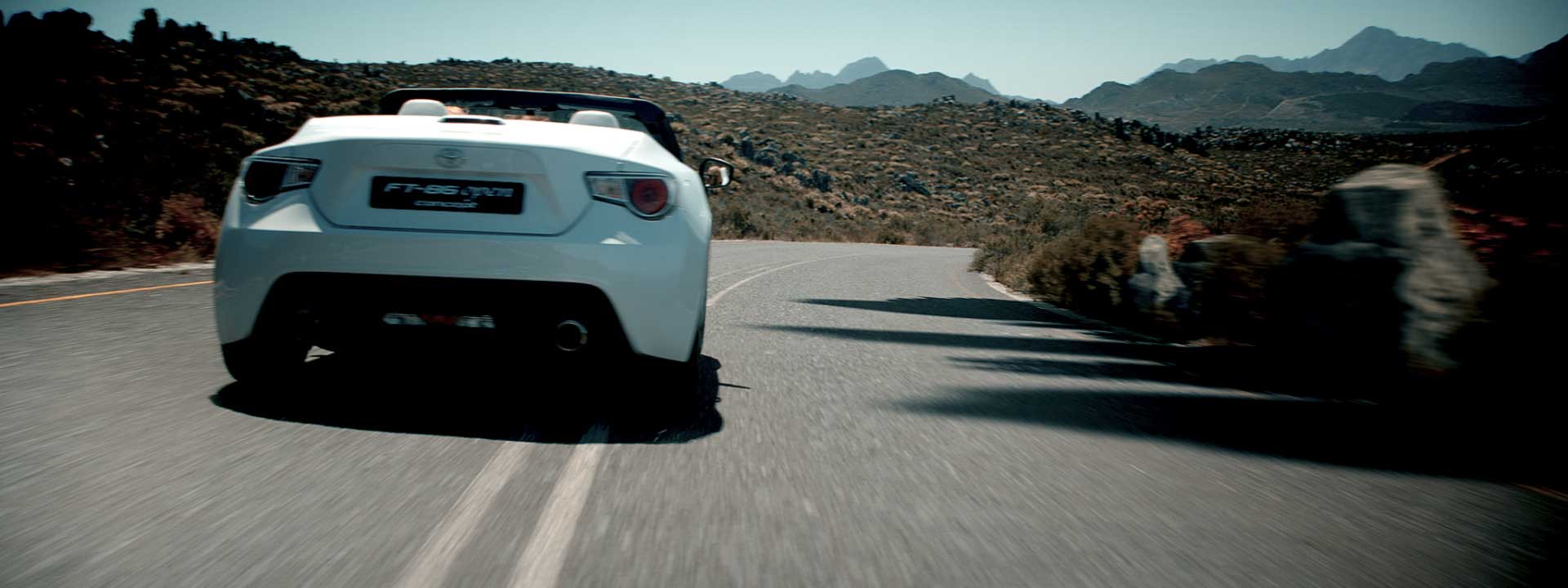 Woman driving car. Still from Toyota FT-86 open – Commercial