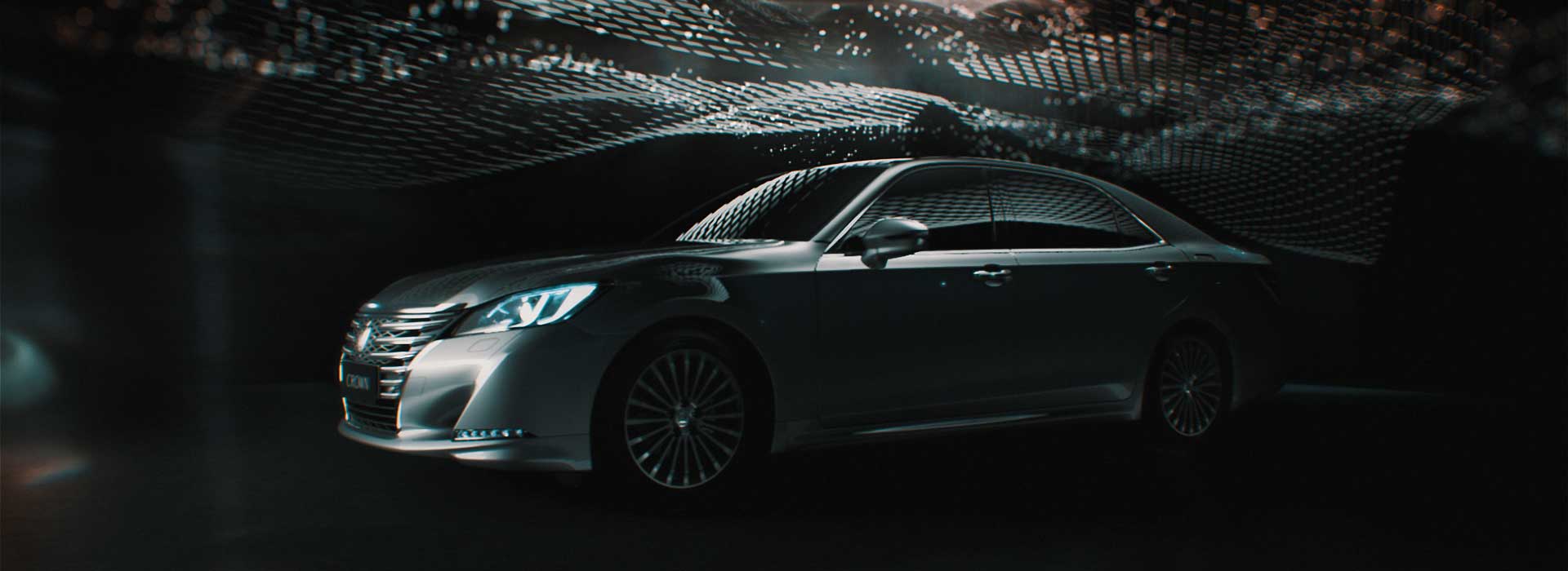 Car with artificially sky. Still from Toyota Crown commercial