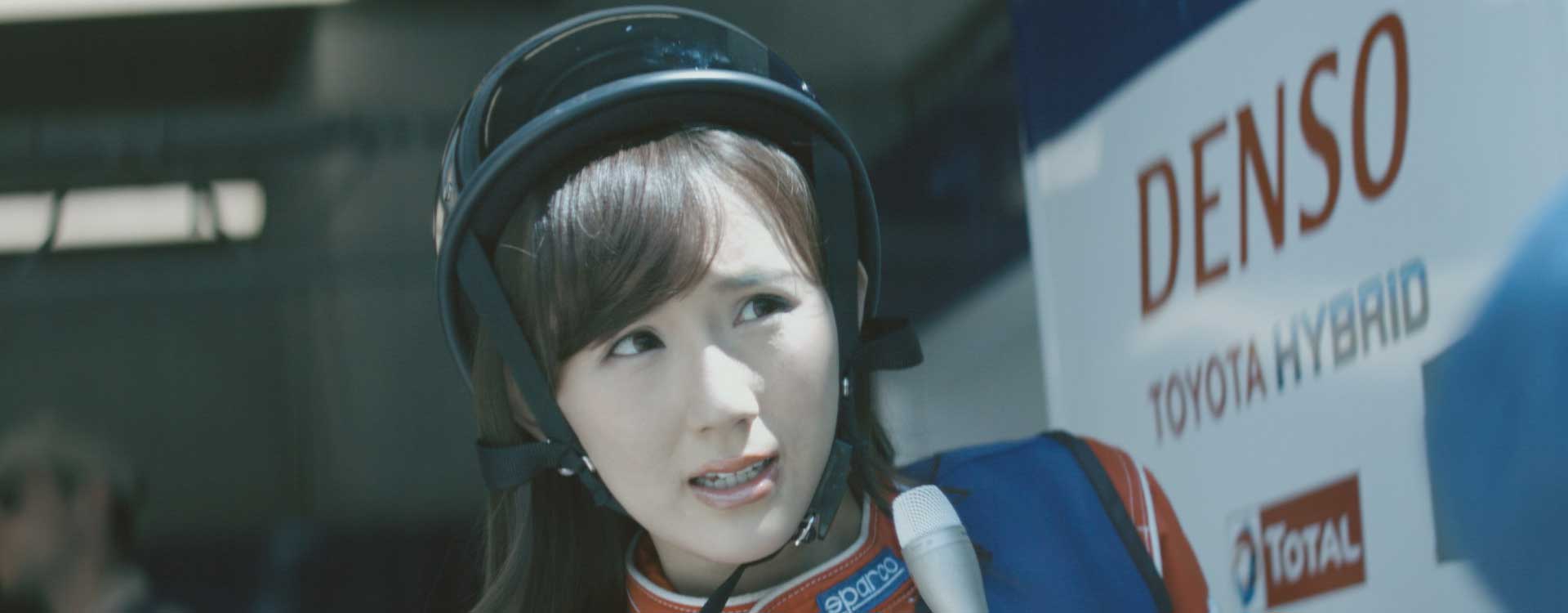 Woman with helmet. Still from Toyota Hybrid Racing - Commercial