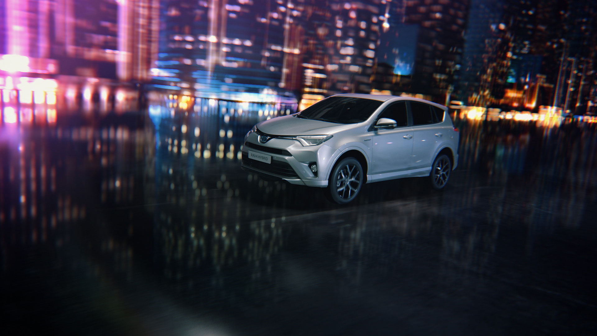 Car in front of city lights. Still from Toyota RAV4.